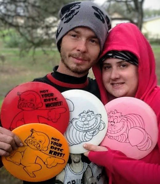 Cody and wife with Cheshire Cat and Evil Monkey custom designs.